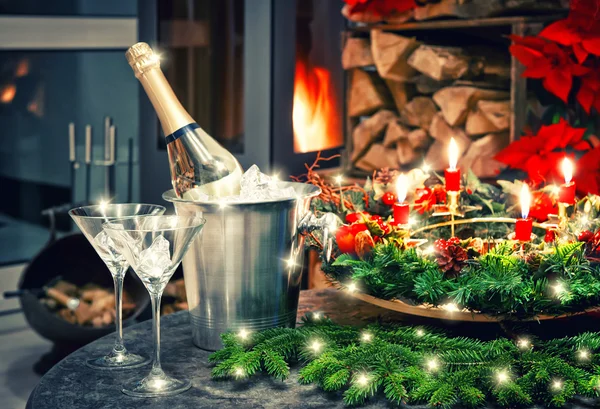 Festive decoration champagne and fireplace and lights — Stock Photo, Image