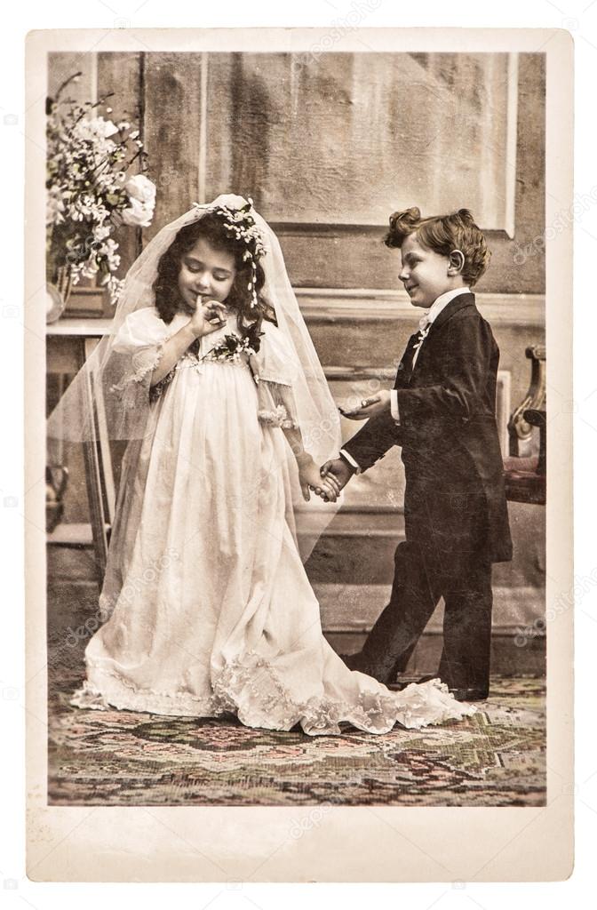 Vinatge photo portrait of little girl and boy in weding dressing