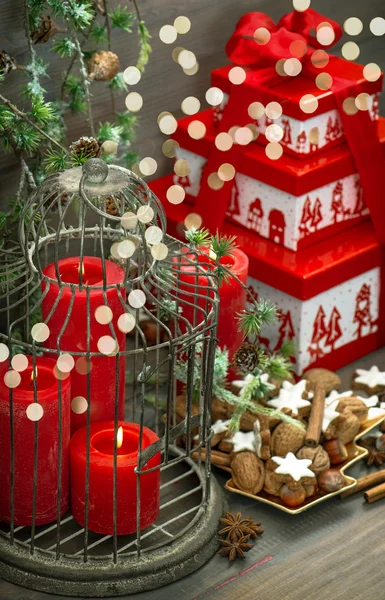 Christmas decoration gift box red candles cookies lights — Stock Photo, Image