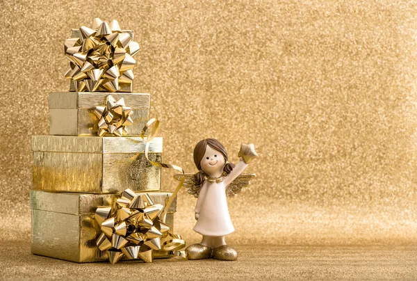 Gift boxes and little angel — Stock Photo, Image