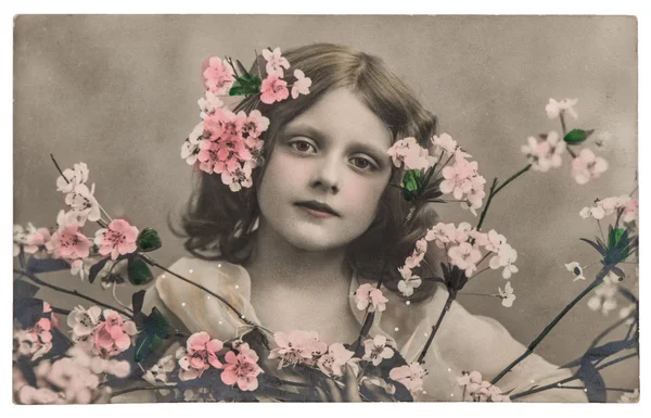Portrét holčička s květinami. Vintage obrázek — Stock fotografie