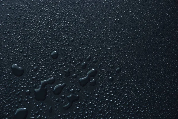 Siyah arkaplan arkaplanındaki su damlaları soyut doku arkaplanı