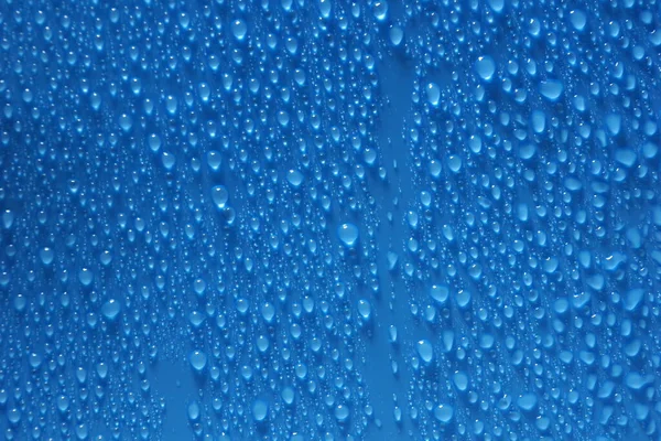 water drops blue color texture background close-up. for design 3D texturing the background with a slideshow or video.