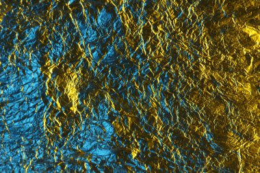 soyut arkaplan dokusu metal alüminyum folyo mavi ve sarı renkli altın arkaplan. Renk dokusu. Doğal güzellik. Asgari biçim.