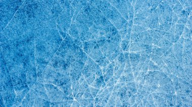 Beautiful ice texture with cracks of a frozen puddle on the asphalt for 3d texturing or design. Beautiful template for cover design. clipart