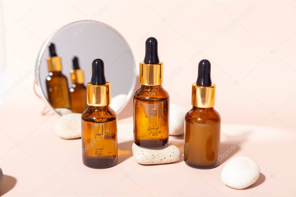 Facial serum glass bottle with pipette, natural organic spa cosmetic. Skin care concept