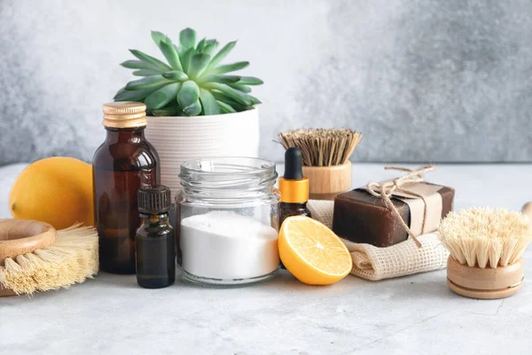 Wooden bamboo brushes, baking soda, lemon, essential oils, vinegar. Zero waste eco friendly cleaning concept — Stock Photo, Image