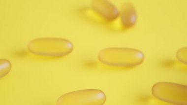 Omega 3 balık yağı kapsüllerini yakın plan sarı arka planda beyaz tabakta. D vitamini kapsülleri.