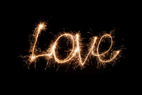 A inscrição "Amor" de sparklers — Fotografia de Stock