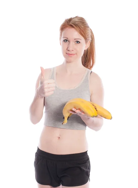 Chica atlética con plátanos en la mano — Foto de Stock