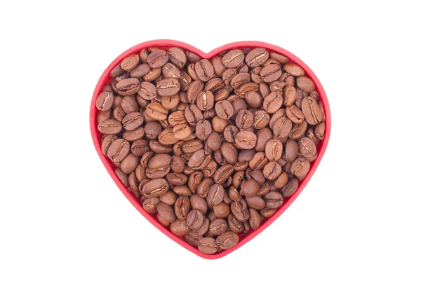 Coffee beans in a dish in the shape of a heart. — Stock Photo, Image