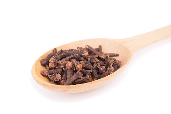 Cloves in the spoon isolated on a white background. — Stock Photo, Image