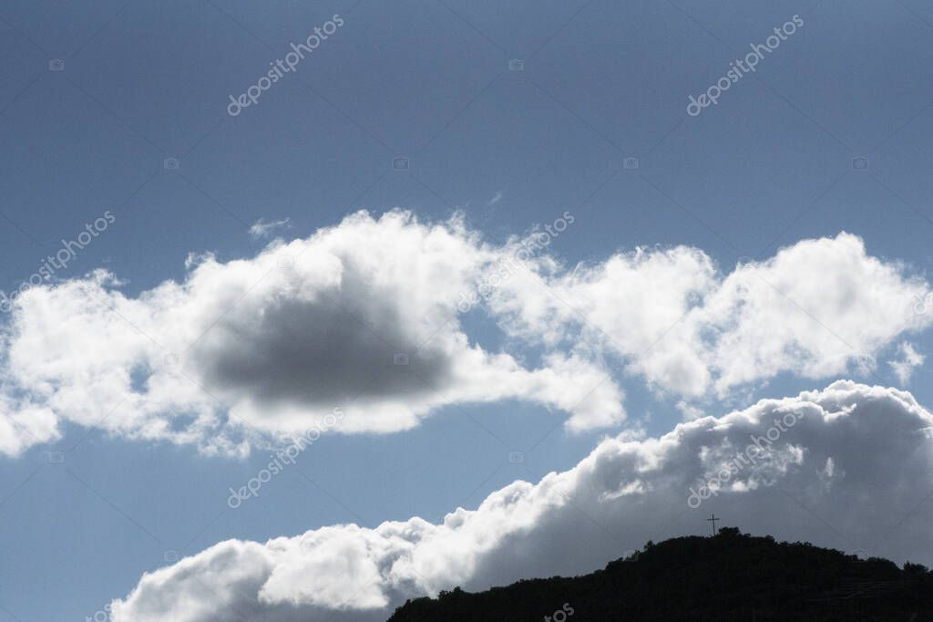 Partially cloudy blue sky with wisps of white and gray clouds natural daylights