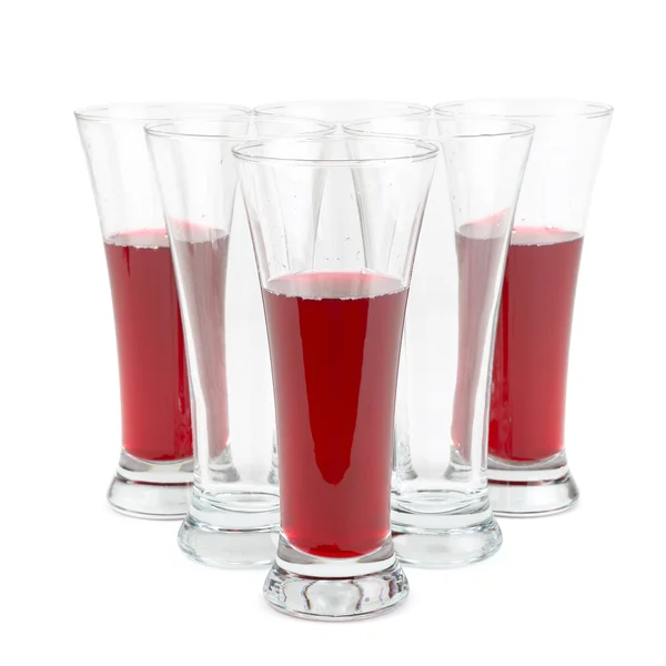 Vasos con zumo de fruta aislado sobre fondo blanco — Foto de Stock