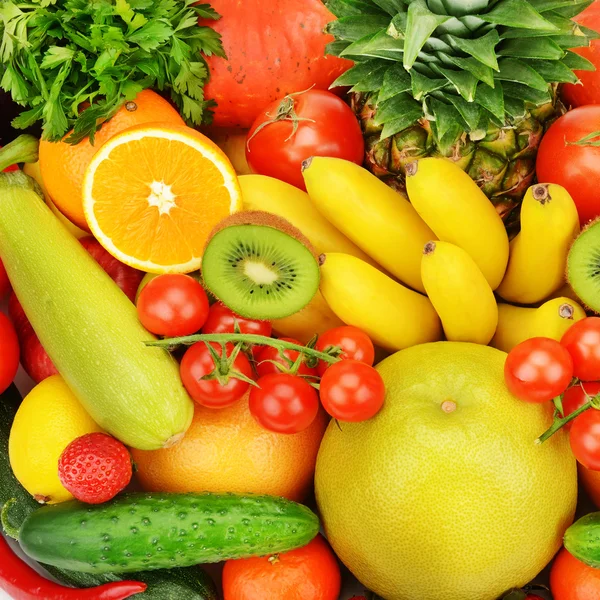 Háttérben a különböző gyümölcsök és zöldségek — Stock Fotó