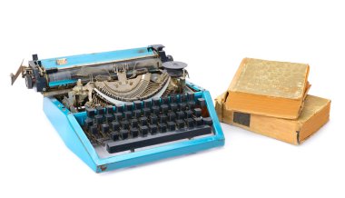 old typewriter and books isolated on white background clipart