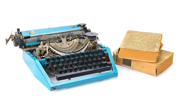 Old typewriter and books isolated on white background — Stock Photo, Image