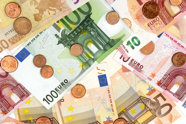 Contesto delle banconote e monete in euro — Foto Stock