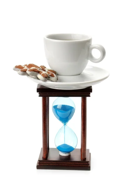 Reloj de arena y una taza de café — Foto de Stock