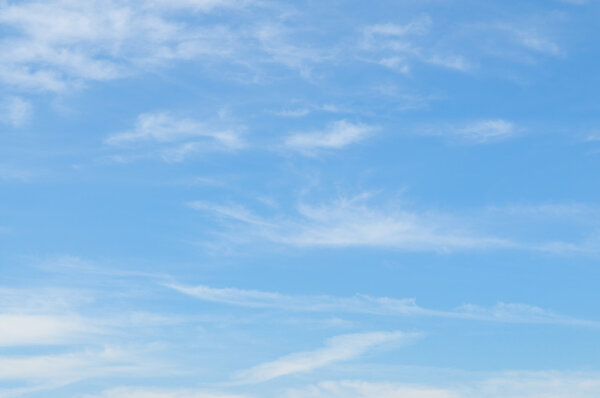 fluffy clouds in the blue sky