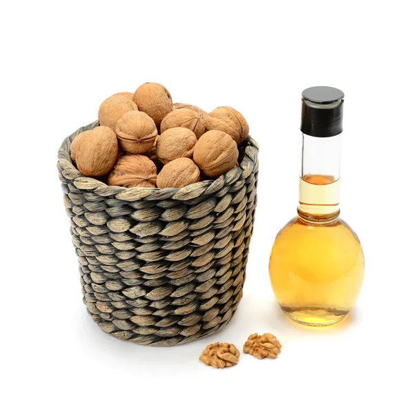 Walnuts and oils isolated on white background — Stock Photo, Image