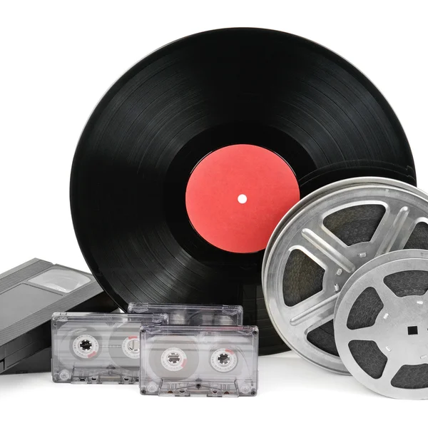 Audio cassettes, records en film strip geïsoleerd op witte backgr — Stockfoto