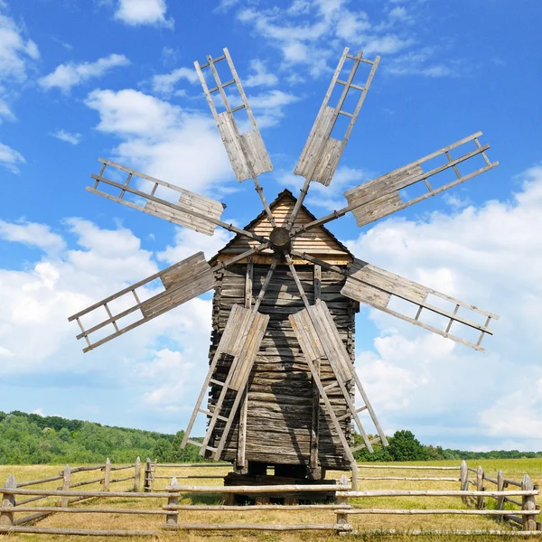 Old wooden windmill in a field Stock Image