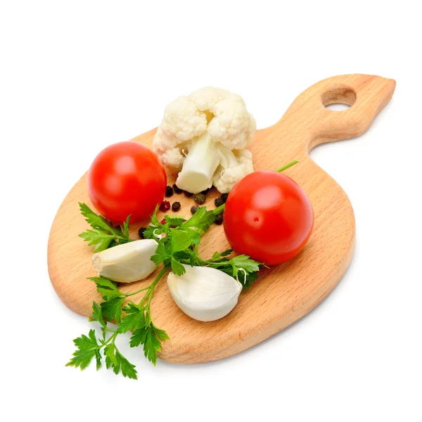 Vegetables and spices on the kitchen board — Stock Photo, Image