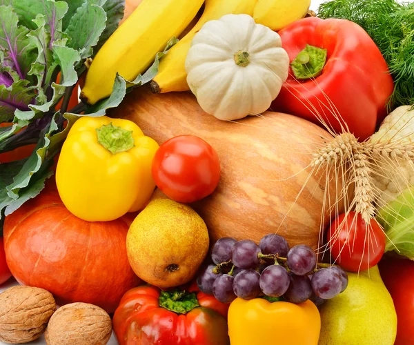 Ljus bakgrund av frukt och grönsaker — Stockfoto