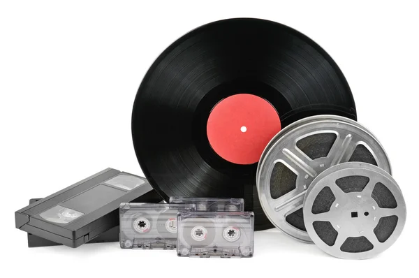 Vinyl record, video and audio cassettes isolated on white backgr — Stock Photo, Image