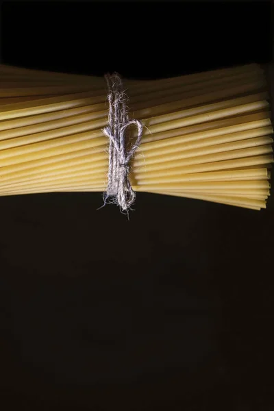 Raw Spaghetti Wrapped Rope Black Background Close Isolated — Stock Photo, Image