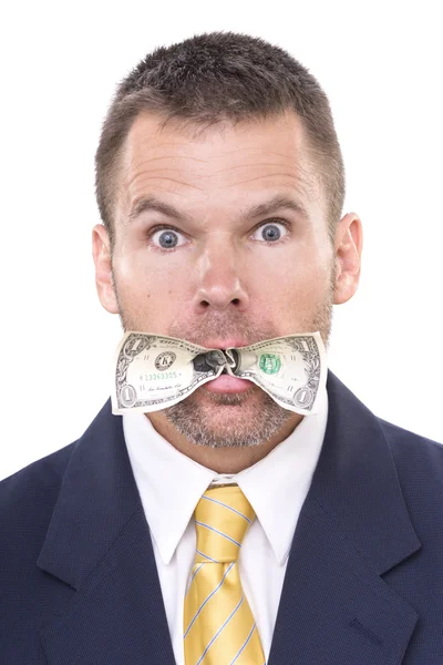 Uomo d'affari che mangia i suoi soldi — Foto Stock