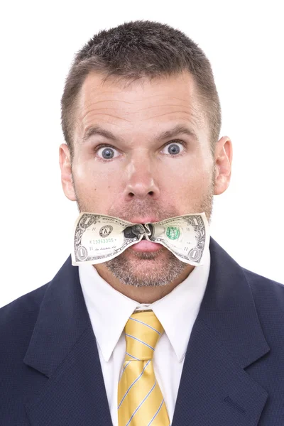 Businessman eating his money Royalty Free Stock Images