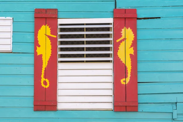 Caribbean style window with sea horse design — Stock Photo, Image