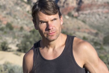 Portrait of adventurous outdoorsman in the desert clipart