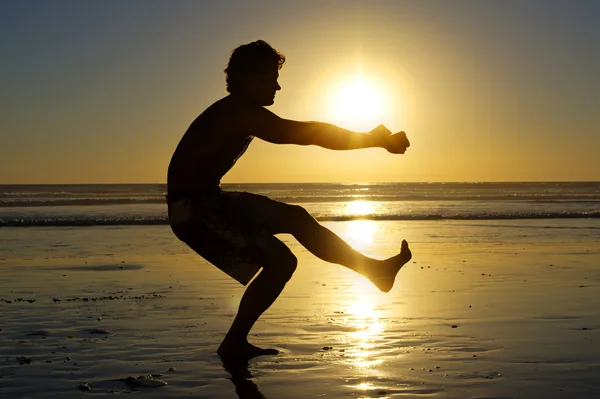 Beach air squats — Stock Photo, Image