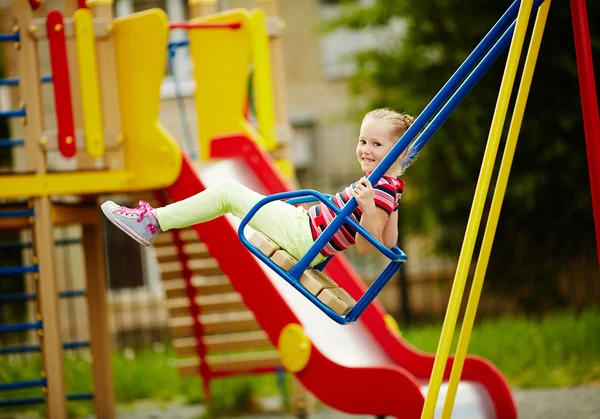 Little girl swinging — Stock Photo, Image