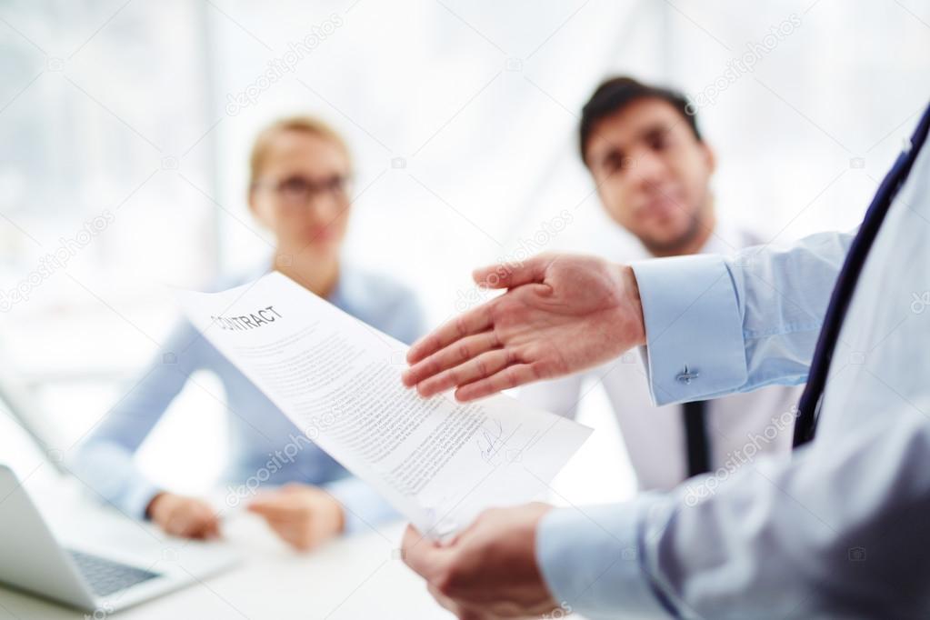 hand pointing at contract