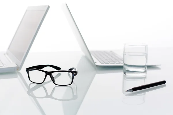 Eyeglasses, pen and glass — Stock Photo, Image
