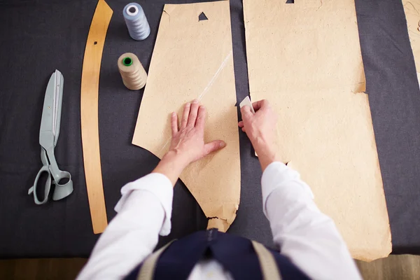 Tailor drawing contours — Stock Photo, Image