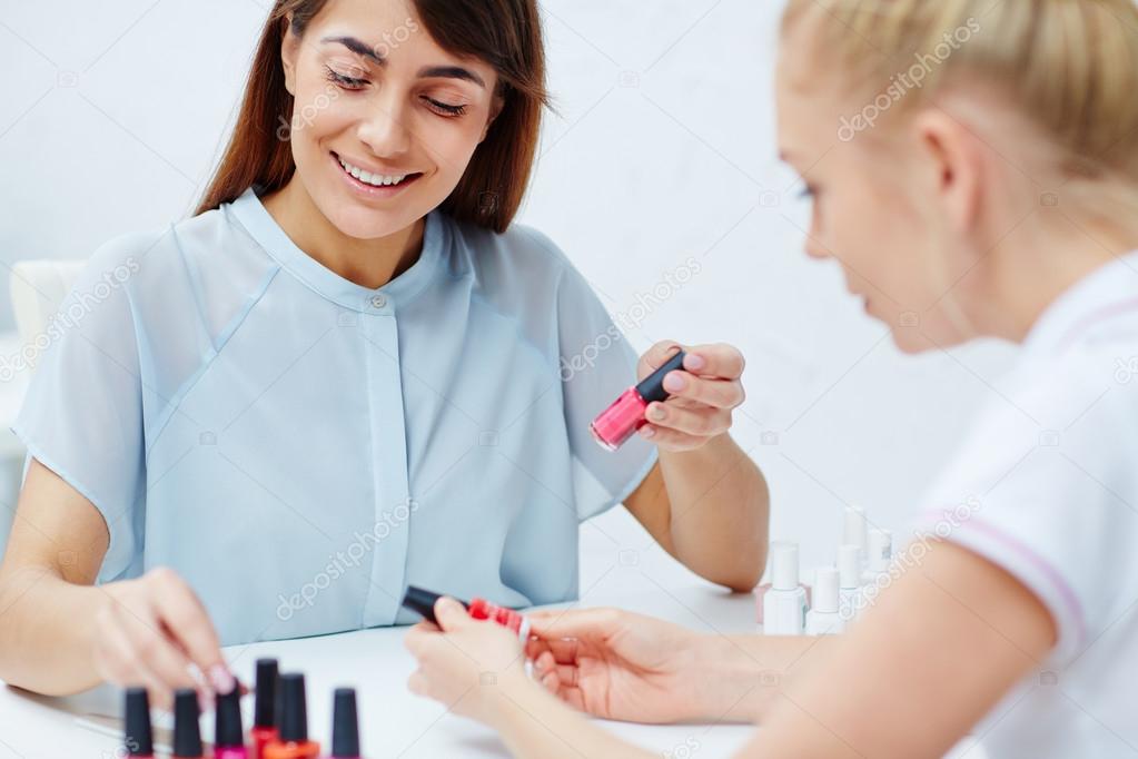 woman choosing nail polish