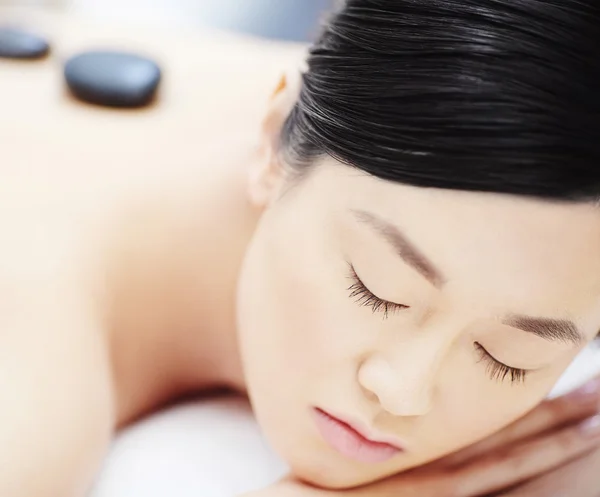 Woman having stone massage — Stock Photo, Image