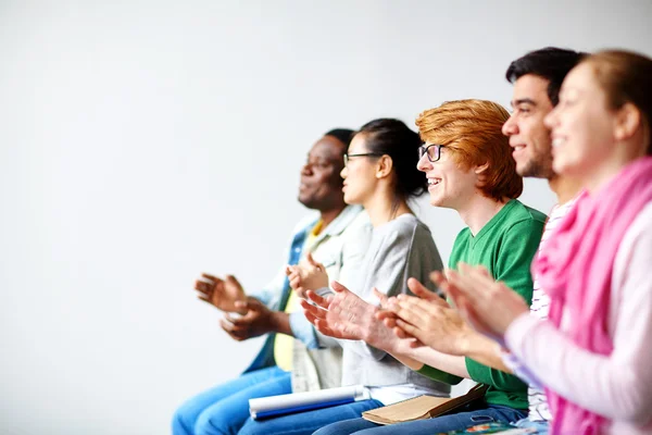 Happy students applauding — Stock Photo, Image