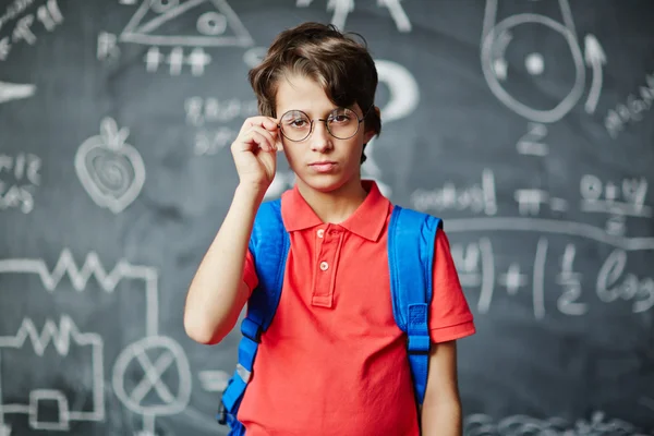 Serious schoolboy in eyeglasses — Stock Photo, Image