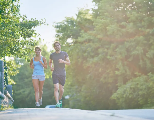 Couple running together — Stock Photo, Image