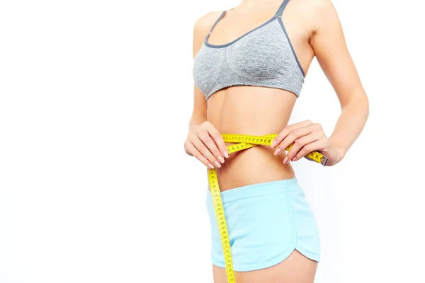 Woman measuring her waist — Stock Photo, Image