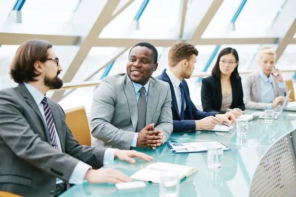 Managers sitting in conference hall — Stock Photo, Image