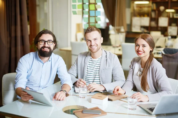 Colleagues sitting at table — Stock Photo, Image