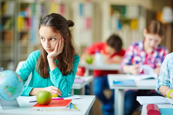 Bored pupil at lesson — Stock Photo, Image