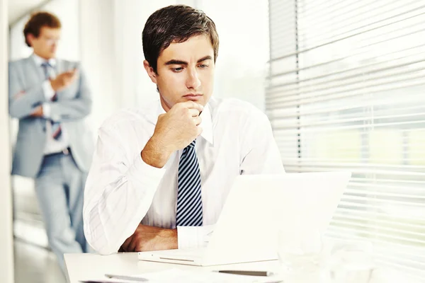 Pensive Businessman with laptop — Stock Photo, Image
